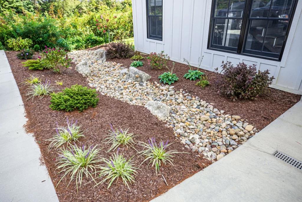 Fresh mulch installation around residential plants