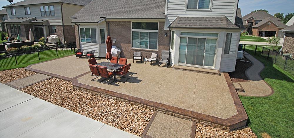 Large exposed aggregate backyard patio